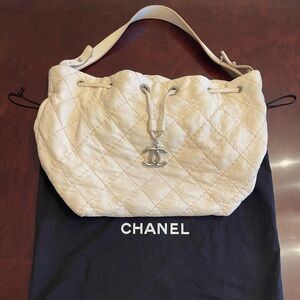 CHANEL Cream Quilted Drawstring Shoulder Bag with CC Charm